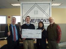 HomeFront Director Sean O'Brien (holding a big check); Vincent Santilli, Executive Director of the People's United Community Foundation (PUCF); and Fanny Ferreira, Vice President and Market Manager for People's United Bank
